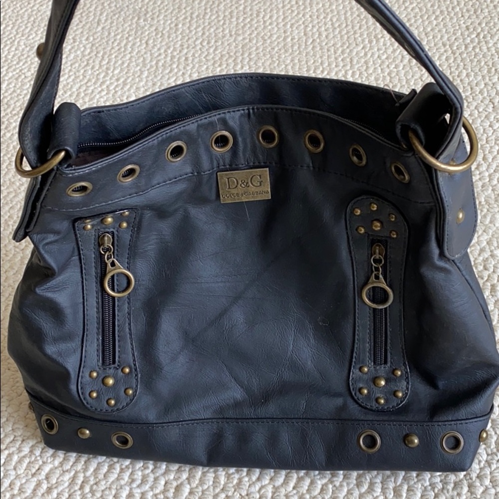 Black pleather purse with studs and grommets